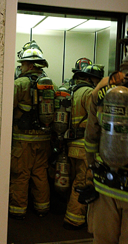 firefighters in elevator