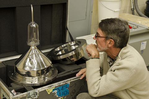 John Wright of the Fluid Metrology Group examines apparatus newly arrived from Mexico as part of an international volume-standard comparison.