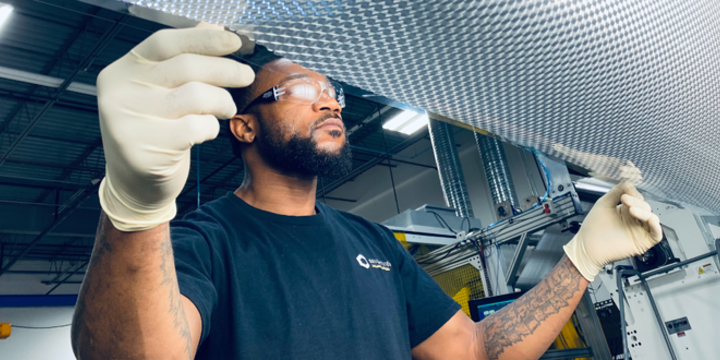 african american worker in a manufacturing facility