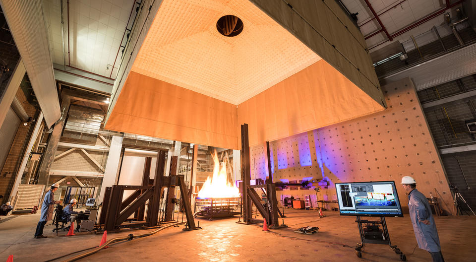 NIST engineers operate various imaging systems to document a structure’s behavior during a fire test.
