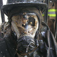 Photo of a burnt faceplate from a firefighter's gear