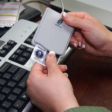 Person putting a PIV card into a reader