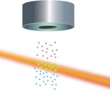 FIGURE 4: Cesium atoms that were altered in the microwave cavity emit light when hit with a laser beam.