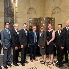 Nine award winners pose for a group photo