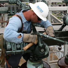 worker repairing an electrical line