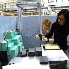 Heather Chen-Mayer loading a jade artifact into a neutron detector