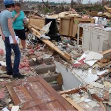 NIST social scientist Erica Kuligowski (left) interviews a tornado survivor in Joplin, Missouri in 2011.