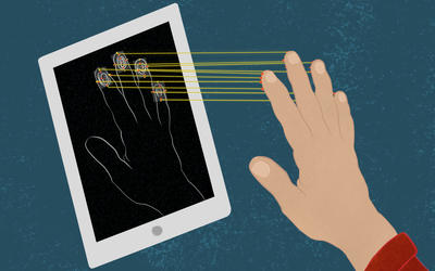 A mobile device scans the fingerprints of a hand held close to the screen. 