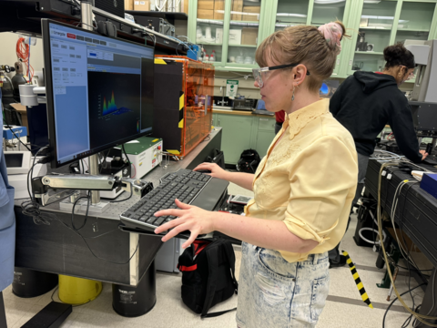 Julie Rieland, a researcher, looks at data on her computer screen in her lab.