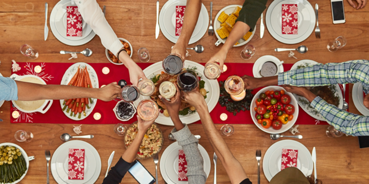 holiday gathering at a table with food and place settings