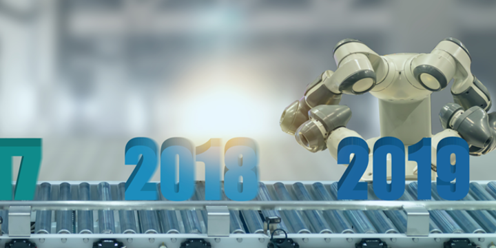 Robot putting the year 2019 on a manufacturing conveyor belt.