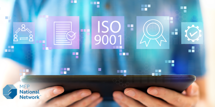 ISO 9001 with man using a tablet stock photo
