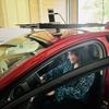 Mahima Arora sits in a red car that is outfitted with special equipment for autonomous vehicle testing.