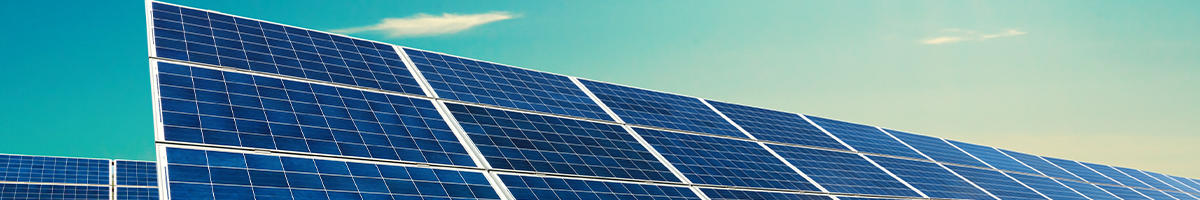 Upclose image of solar panels on blue sky